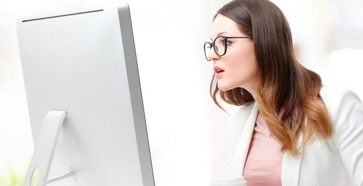 girl staring shocked at computer