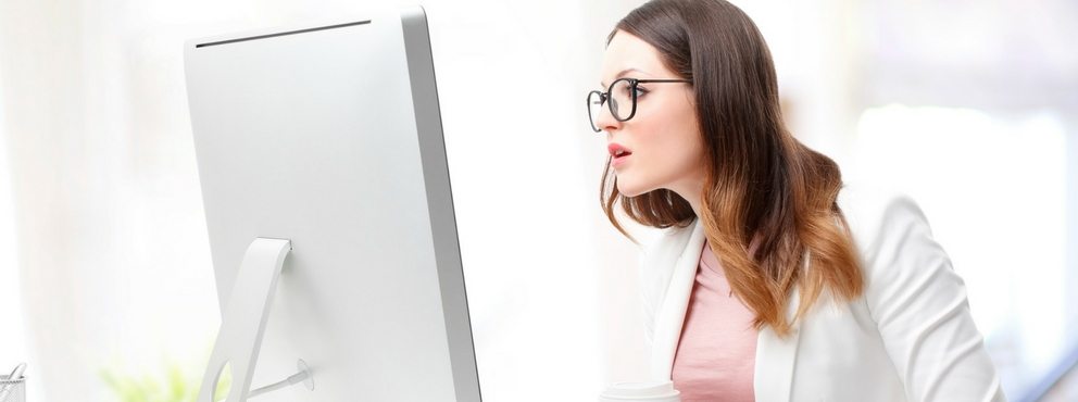 girl staring shocked at computer